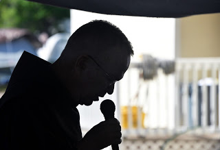 Fr. Kevin Mackin offers opening prayer