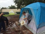 Hurricane Hermine_Amanda Harris bails water out of tent
